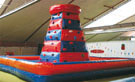 Climbing tower with ascending protection